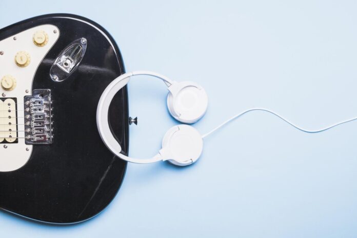 headphones-near-black-guitar
