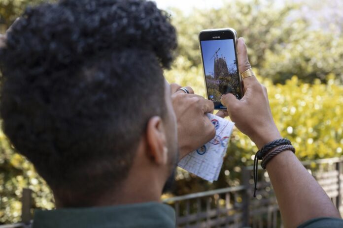 side-view-man-taking-photos-with-smartphone-1