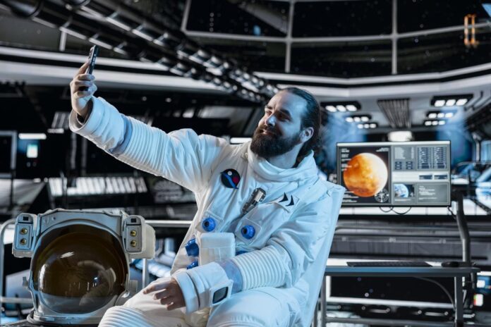 astronaut-wearing-spacesuit-inside-spacecraft-doing-selfie-with-smartphone