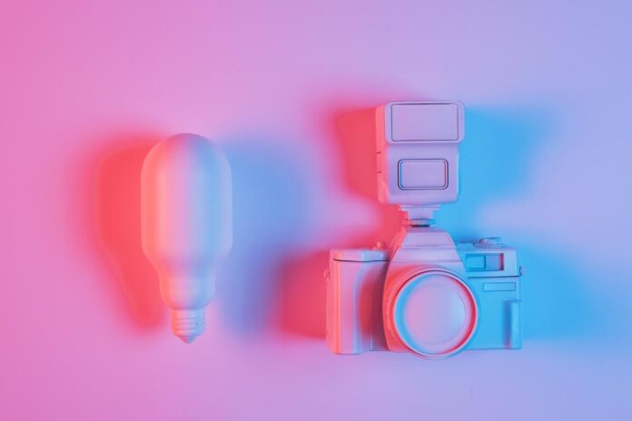 pink-light-bulb-camera-with-blue-light-pink-surface